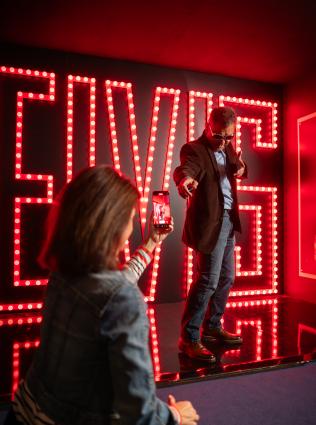 couple in front of elvis sign