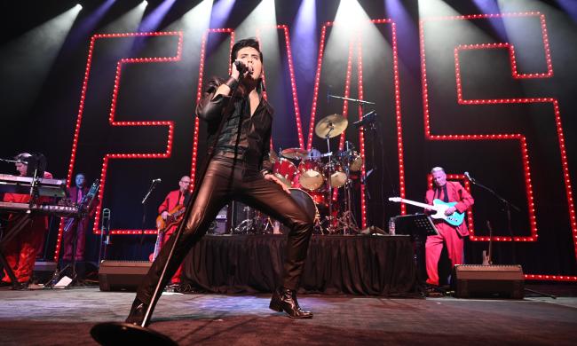 Elvis impersonator performing at Elvis Presley's Memphis.