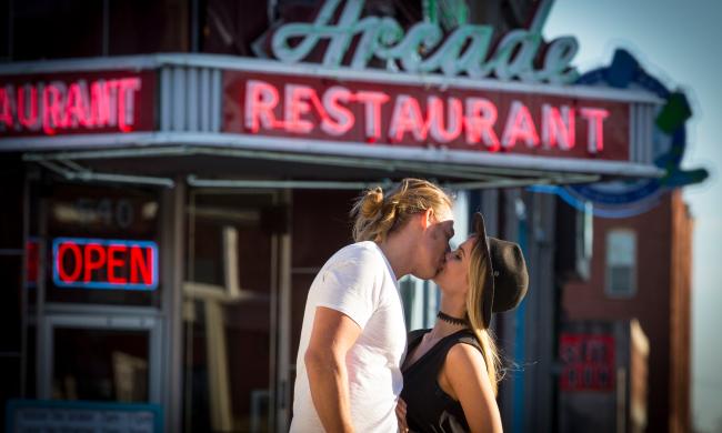 Couple kissing in Front of the Arcade