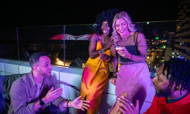 Friends at the rooftop bar Beck &amp; Call at Hyatt Beale Street Memphis