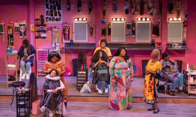 Actors on stage at Hattiloo Theatre for the production of Jaja's African Hair Braiding.