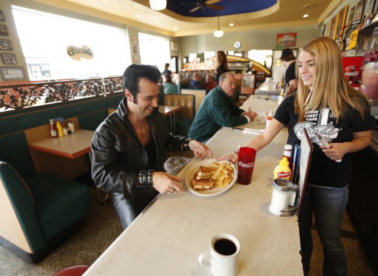 Elvis Tribute Artist enjoys a meal at The Arcade Restaurant, one of Elvis' favorite spots. Photo
